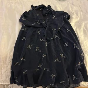 Navy short dress with long sleeves and white birds